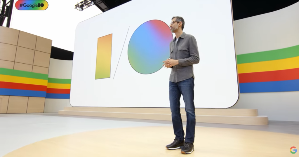 Man speaking at Google I/O event.