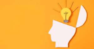 Head silhouette with lightbulb idea