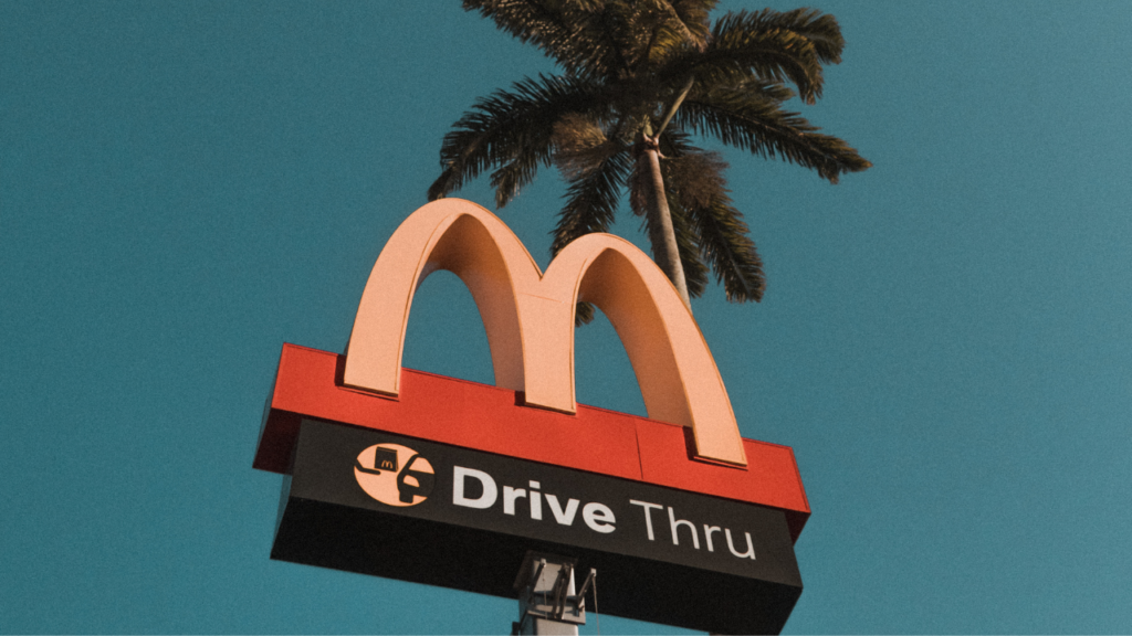 McDonald's drive thru sign with palm tree.