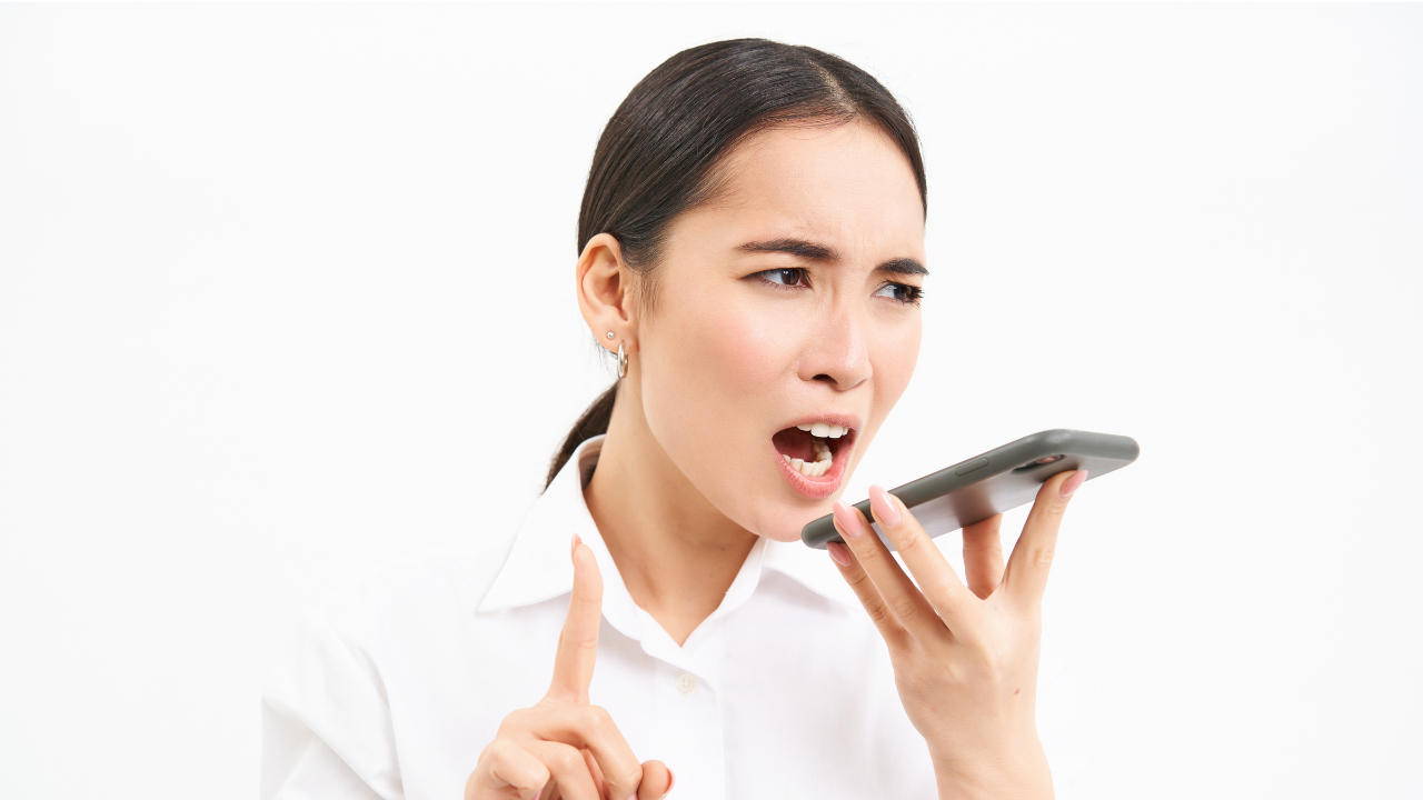 woman yelling into a cell phone