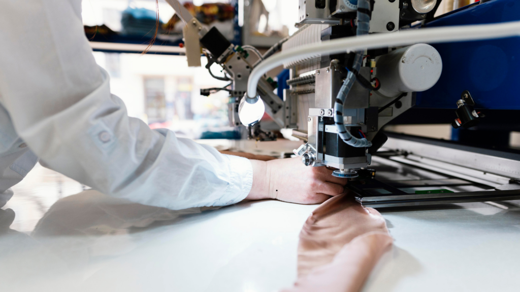 image of woman in a factory sewing clothes