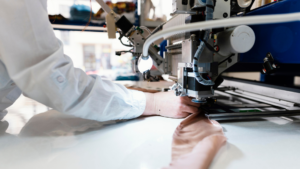image of woman in a factory sewing clothes