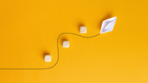 illustration of a paper boat going around obstacles