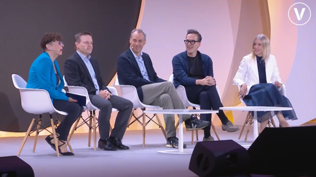 Photo of moderator, Volvo's Jens Holtinger, Siemen's Cedrik Neike, SAP's Sebastian Steinhaeuser, and Mistral AI's Marjorie Janiewicz
