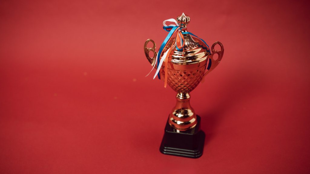image of a lone trophy on a red background