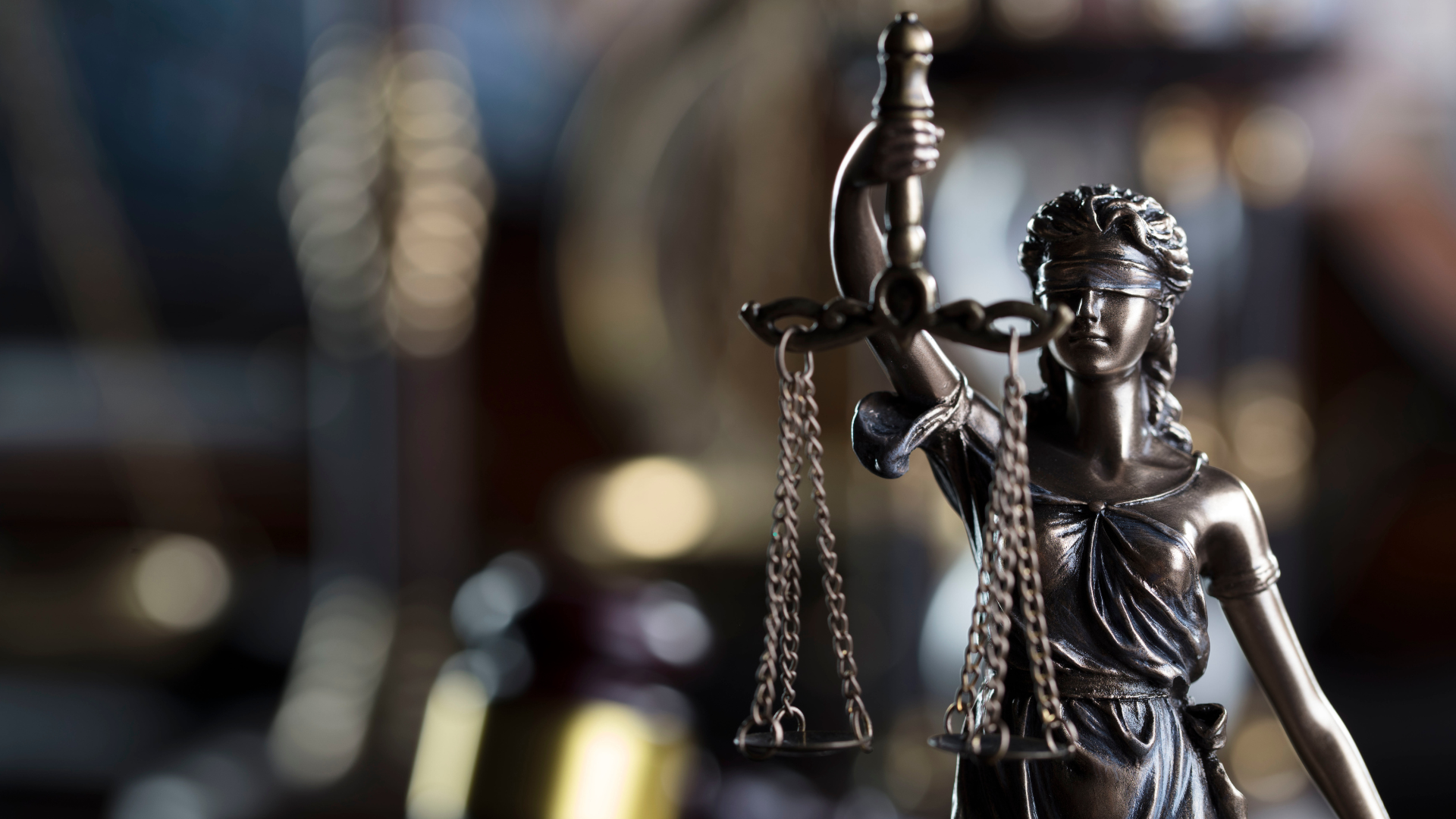 Stock photo showing a bronze lady justice statuette