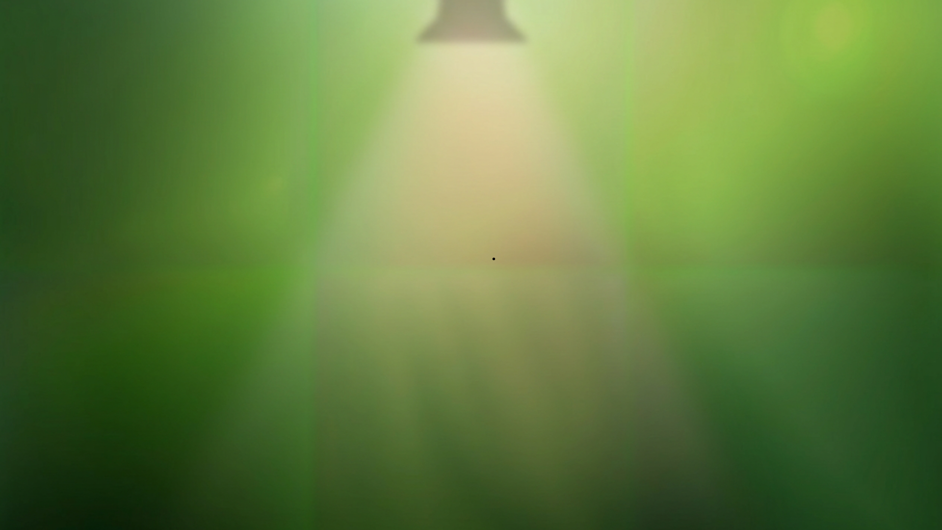 Image of a spotlight silhouette on a green background