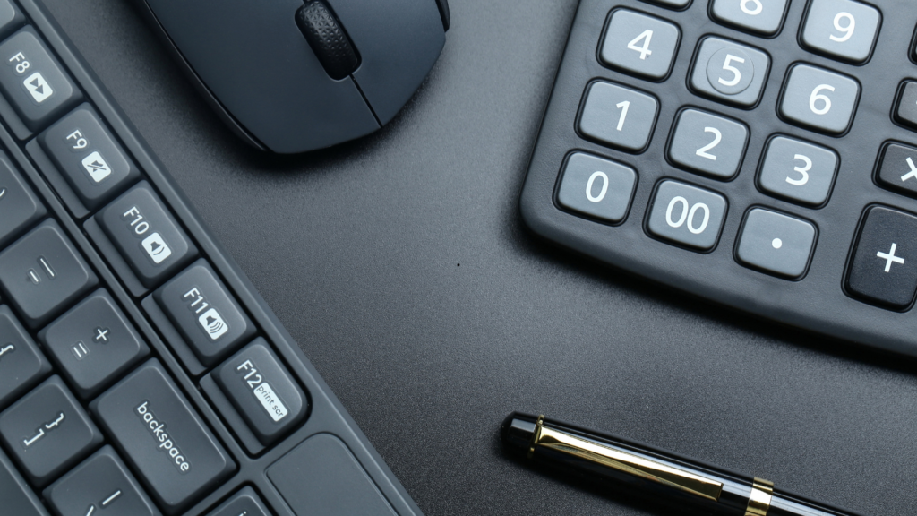 stock photo featuring a keyboard, mouse and calculator